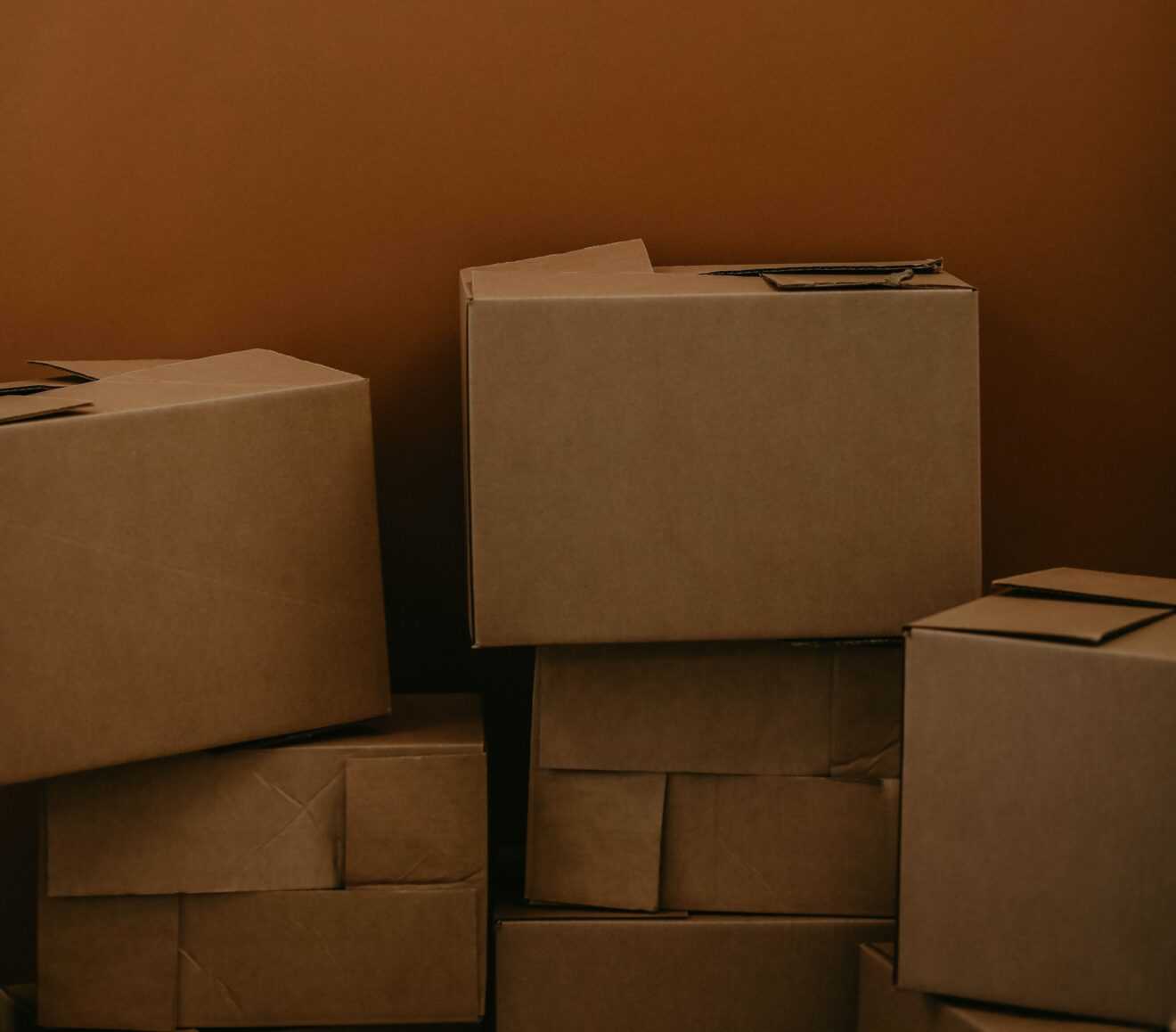 Image of boxes being packed for moving, which is another closing cost to consider when buying a house
