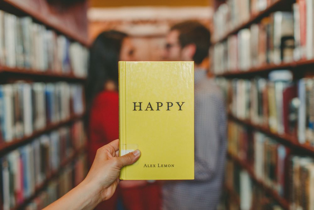 finding a book titled happy in a library